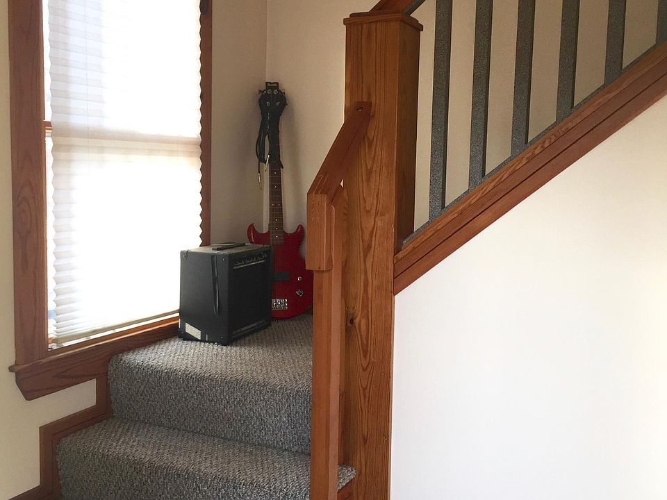 Stairs leading from coat area to apartment