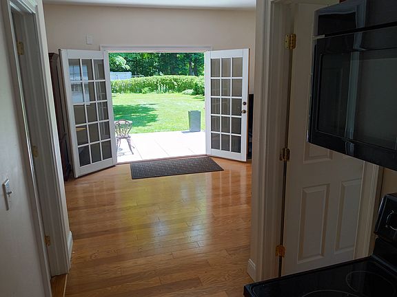 view from kitchen. Door to bedroom on right