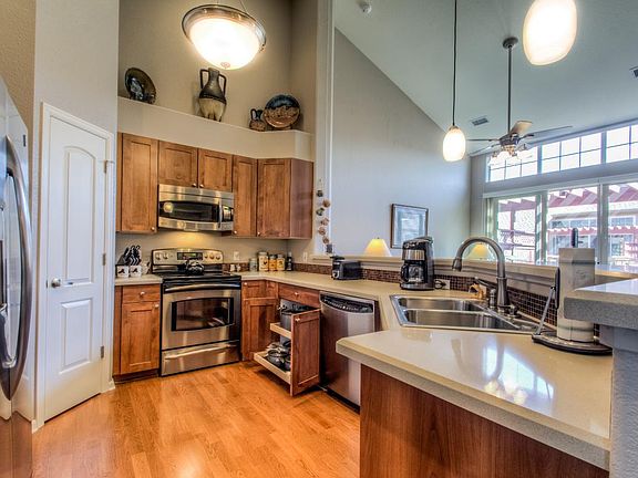 Stainless Kitchen w/pull-out drawers, solid surfaces
