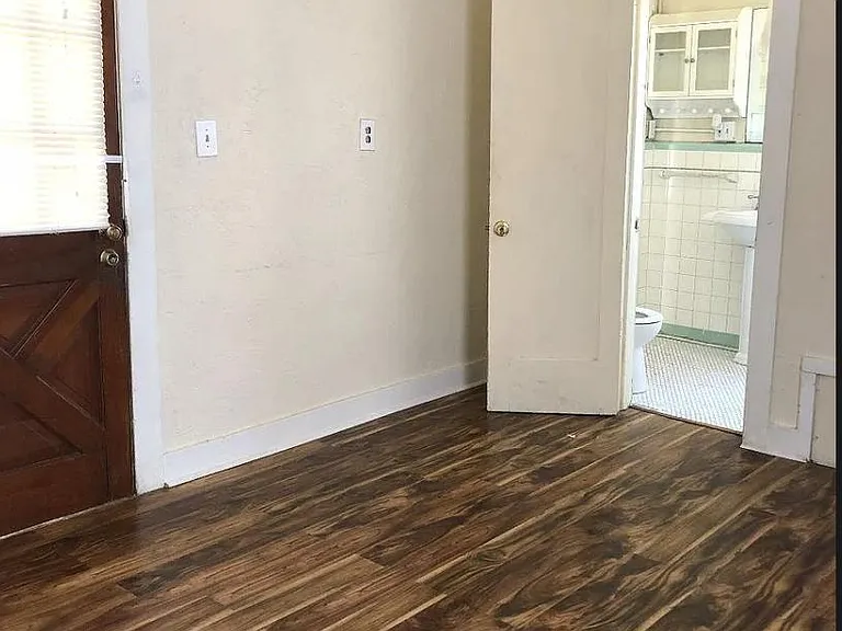 Bedroom 4 opens out into the bricked in courtyard.