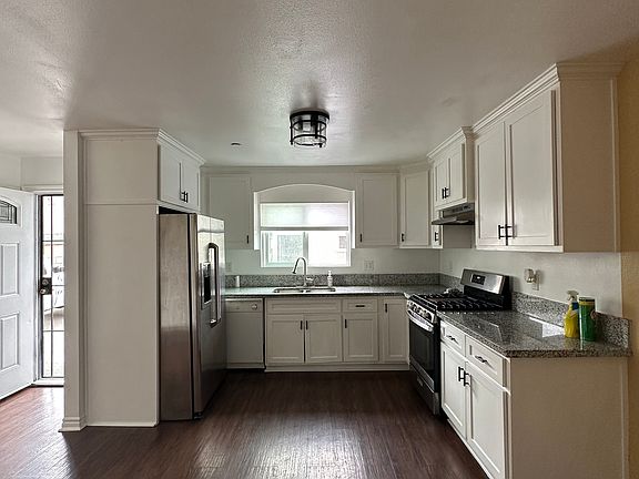 Kitchen with Fridge & Stove.