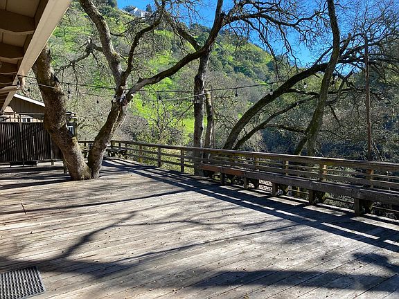 Large deck overlooking rolling hills is perfect for entertaining.