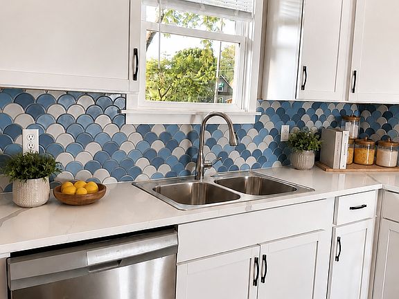 Completely updated kitchen with new appliances, cabinets, and fixtures.