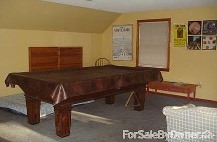 Extra room over garage
						:
						Built in storage drawers and large book shelf. Plenty of room for tv, sofa, etc