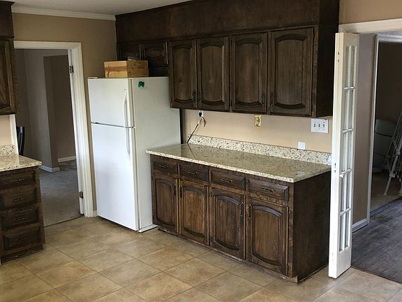 Kitchen-access to dining room, foyer, outside deck.