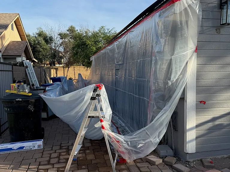 REMODEL: Prepping to wash out the pigeon waste and wire around the solar panels so pigeons can not return and roost.