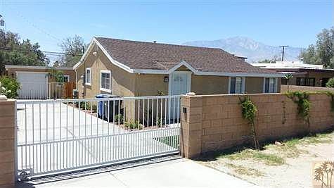 Front view with block wall and rolling gate