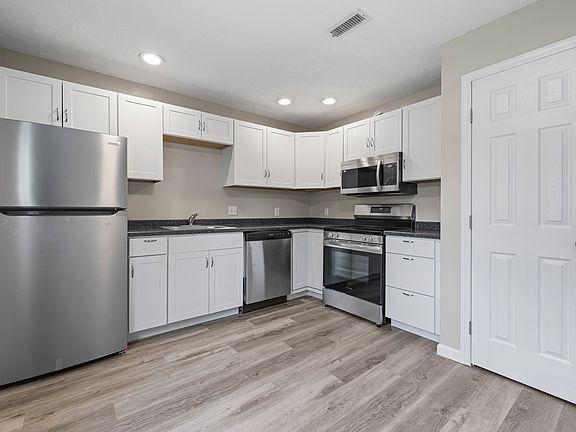 Updated kitchen with modern appliances.