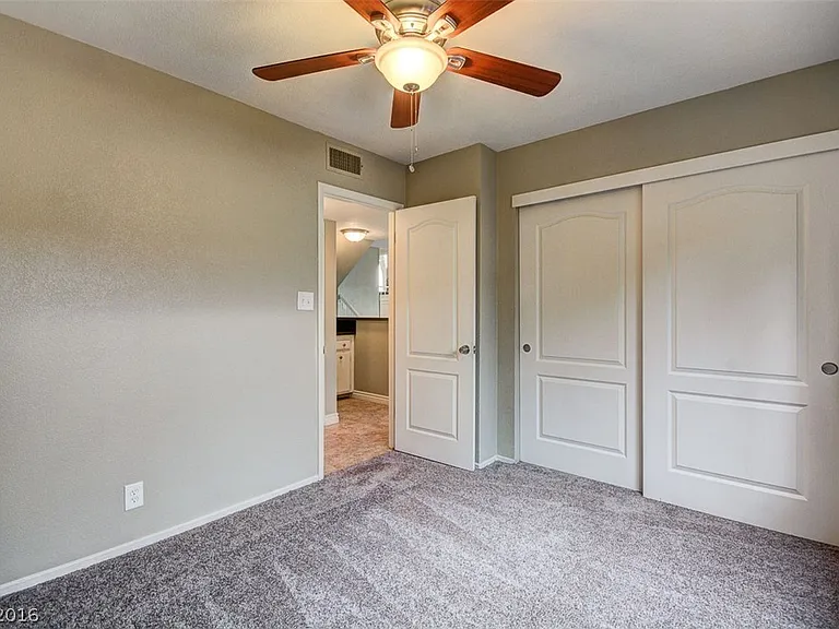 The flooring has been upgraded to laminate_there is no longer any carpet in this room