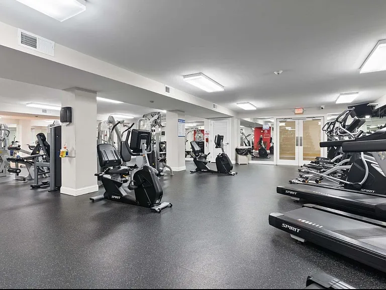 Fitness center has TV, locker rooms, bathrooms, swipe card & camera for security.