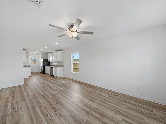 Beautiful vinyl flooring are found throughout the family room and kitchen