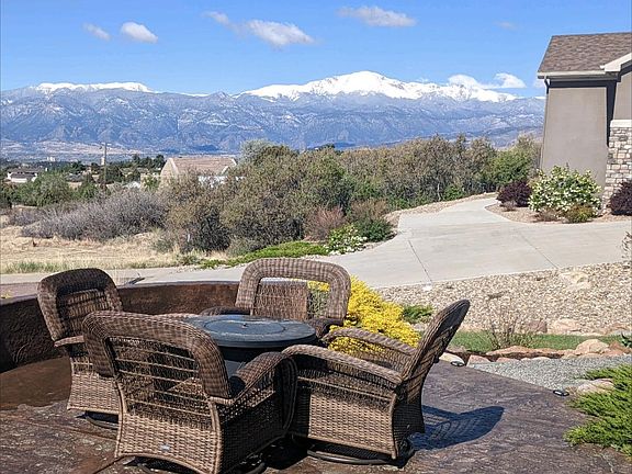 Unbeatable City lights and mountain range views from the front patio of this custom home in Austin Heights!