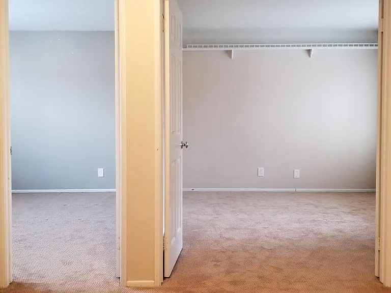 View of bedrooms #1 and #2 from top of the stairs