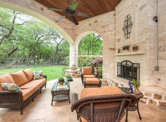 Back patio - notice the fireplace and the beautiful stone detail