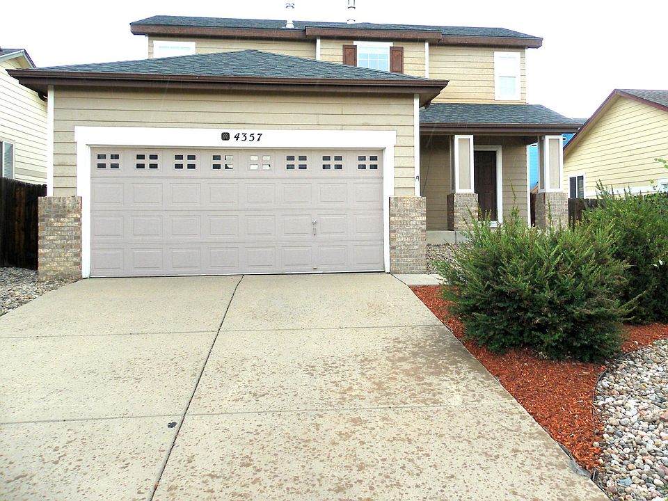 Front of property to show 2-car garage