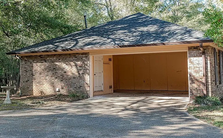 Two-car carport with large utility closet