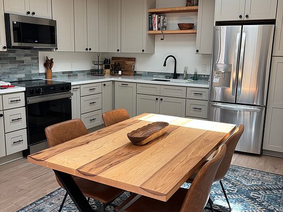 Spacious kitchen with brand new amenities.