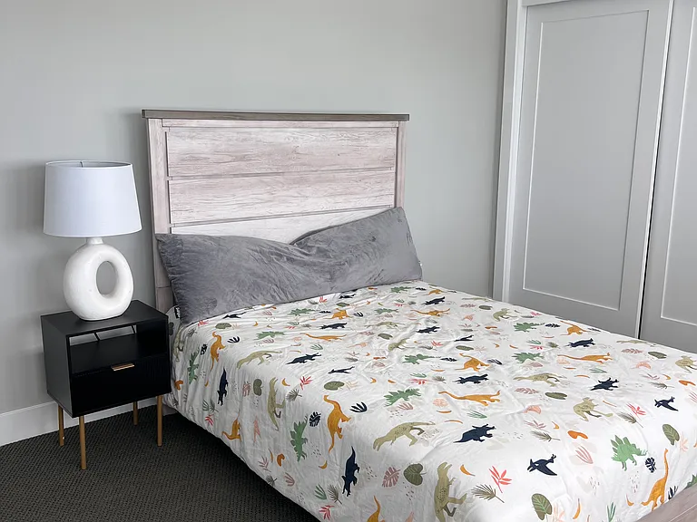 Large secondary upstairs bedroom, could fit another twin bed or daybed