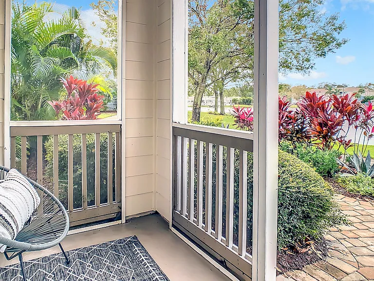 Discover secluded outdoor sanctuaries on your screened-in patio, offering a private retreat amidst serene lake views and lush greenery.