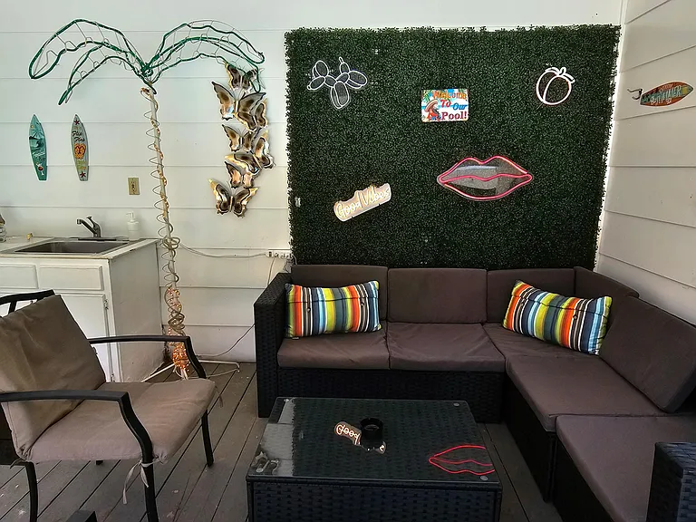 Pool house lounge with outdoor kitchen (sink only usable in summer pool season)