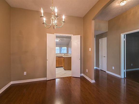 View of dining room to the kitchen .