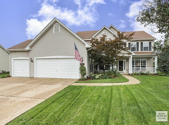 Three Car Garage and Spacious Concrete Driveway.
