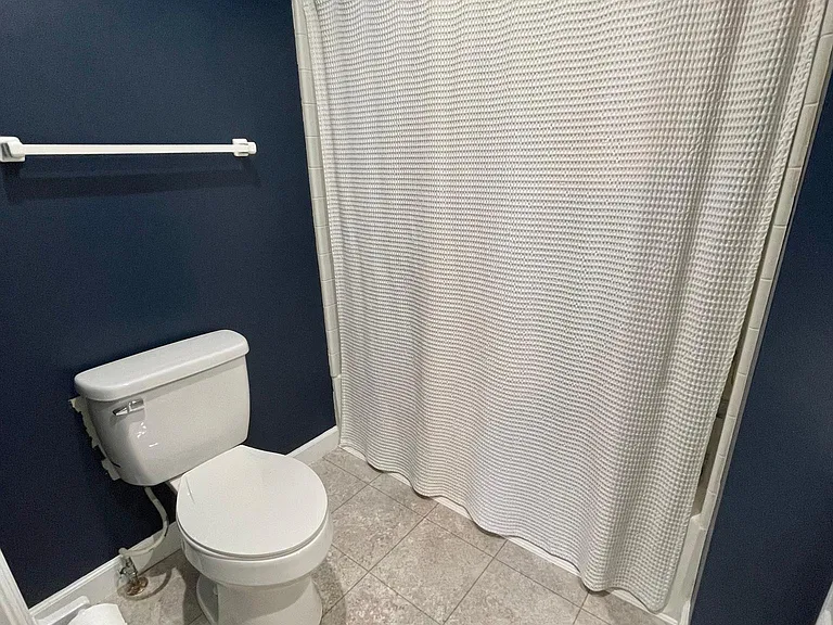 Ensuite master bath features a brand new toilet, a bathtub/shower combination with exceptional water pressure, and under-cabinet storage.