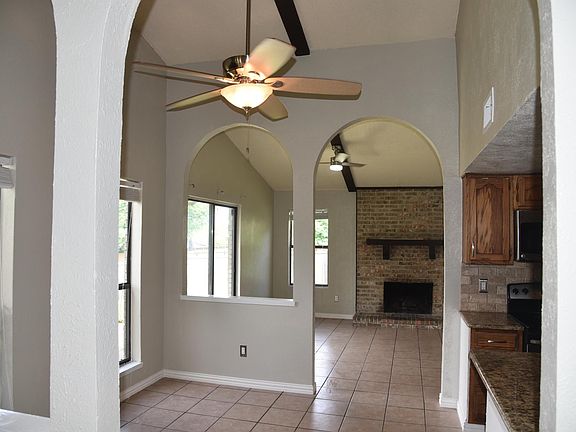 Dining Area has two windows and opens to Kitchen and Den.