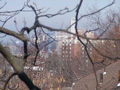 You can see the city from behind the house.