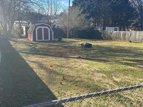 Backyard with storage building.