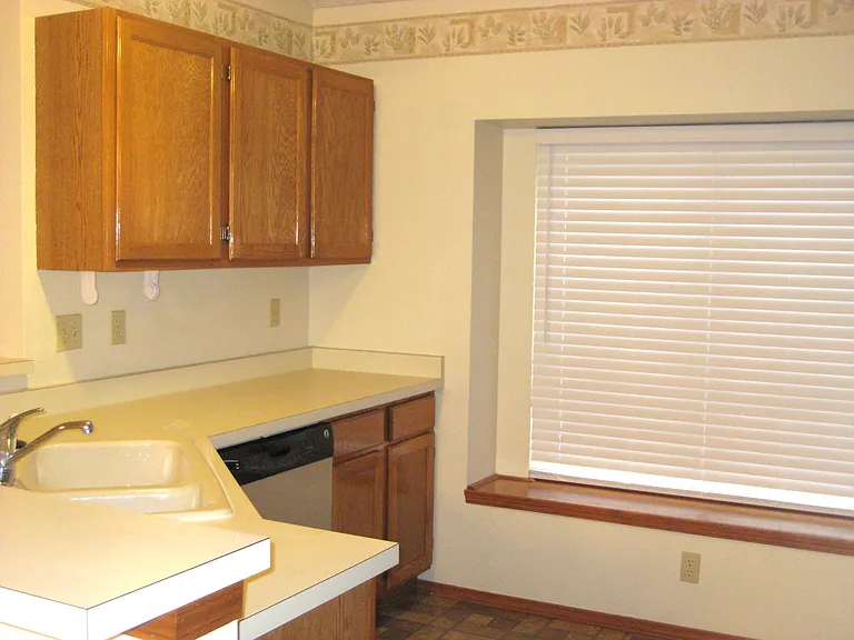 Kitchen with sit-down bay and large cabinets