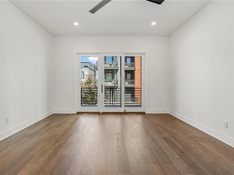 Living Room (Note: Actual unit has light wooden floors and upgraded fixtures / appliances)