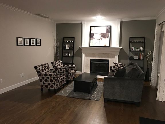 living room open to kitchen, eat in nook, and huge deck