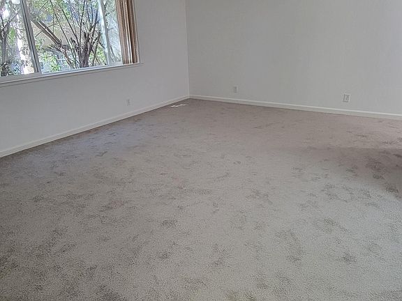 Carpeted living room - taken from hallway to bedrooms