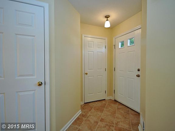 Foyer with Coat Closet and Access to Half Bath