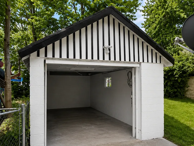 Private detached garage providing convenient off-street parking and additional storage.