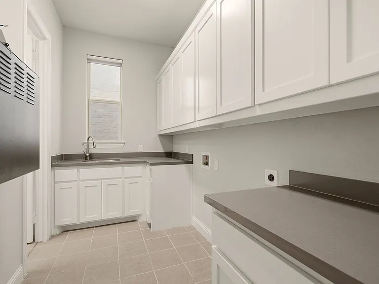 Full Sized Laundry Room with Sink and Storage
