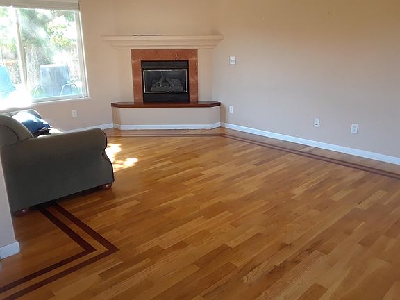 Gas fireplace at back of living room