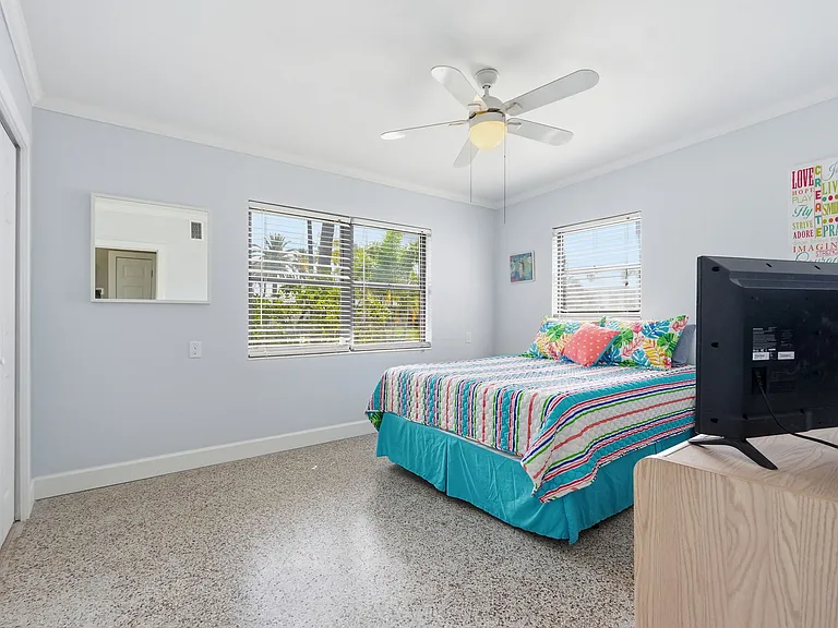 Bedroom #1 with Queen Bed and good lighting from Windows. Lots of closet space and 42 inch TV.