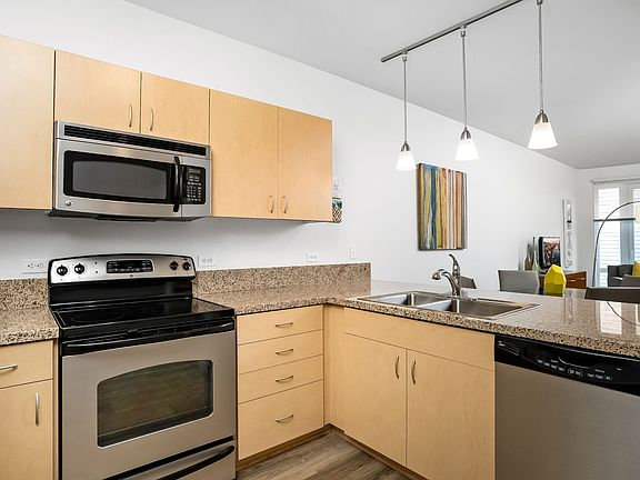 Spacious gourmet kitchen with stainless steel appliances