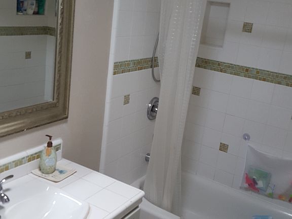 Guests, kids bathroom, double sinks with separating pocket d