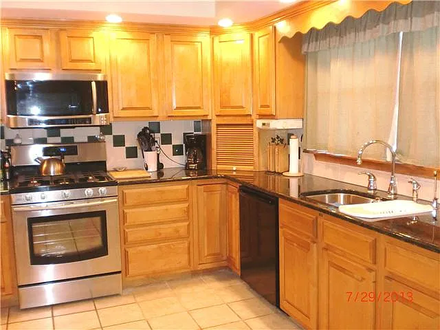 New granite, gas range & microwave 2013