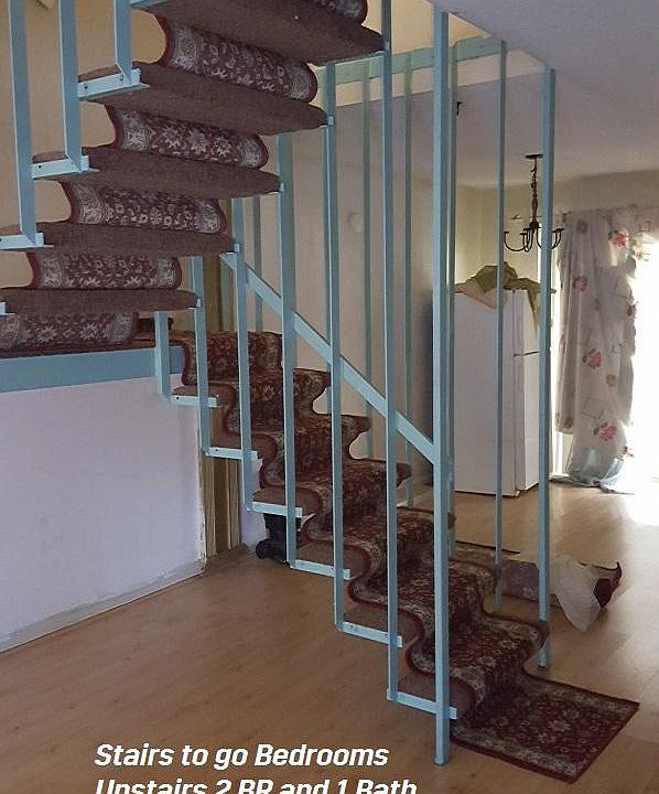 Stairs that take to upstairs 2 BR and 1 Bath