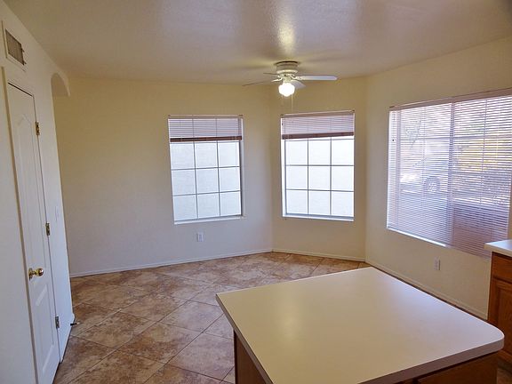 Breakfast nook in eat-in kitchen is bright with lots of wind