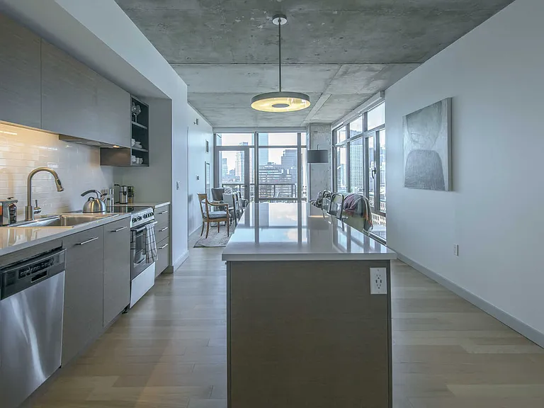 Open Kitchen with Expansive Island and Quartz Countertops
