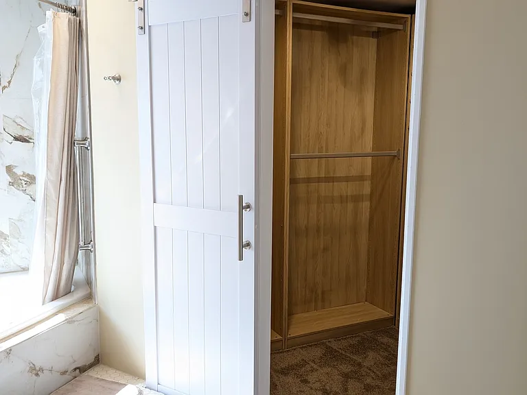 Customizable master closet adjacent to master bathroom.
