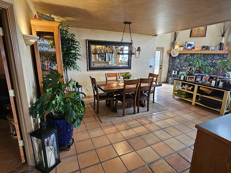 Shared dining room, to left is the TV room with french doors