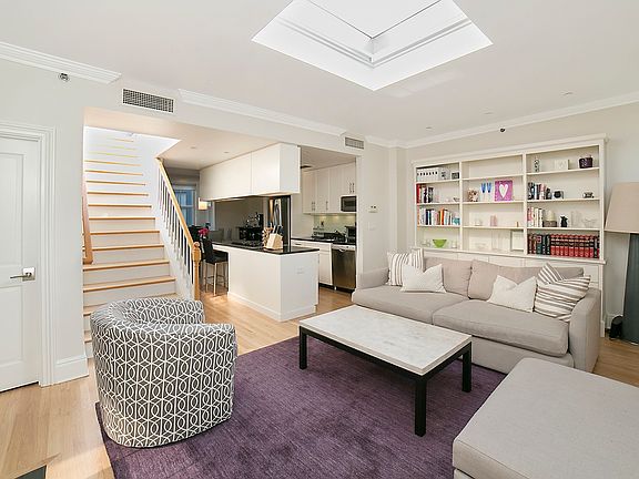 Living area, stairs to roof deck