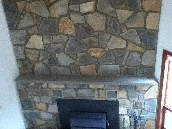 Two Story Stone Hearth with Wood Stove
