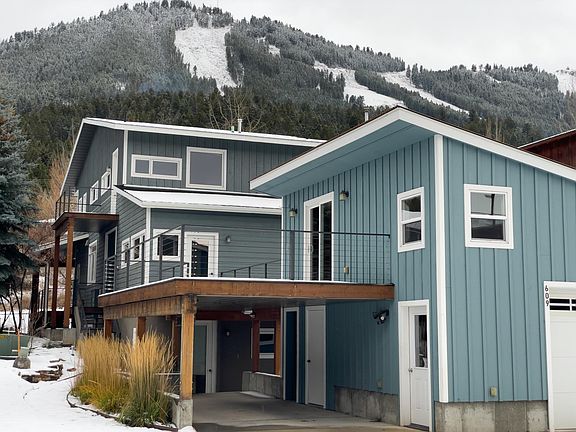 Back exterior in Winter with Snow King Mountain in background.